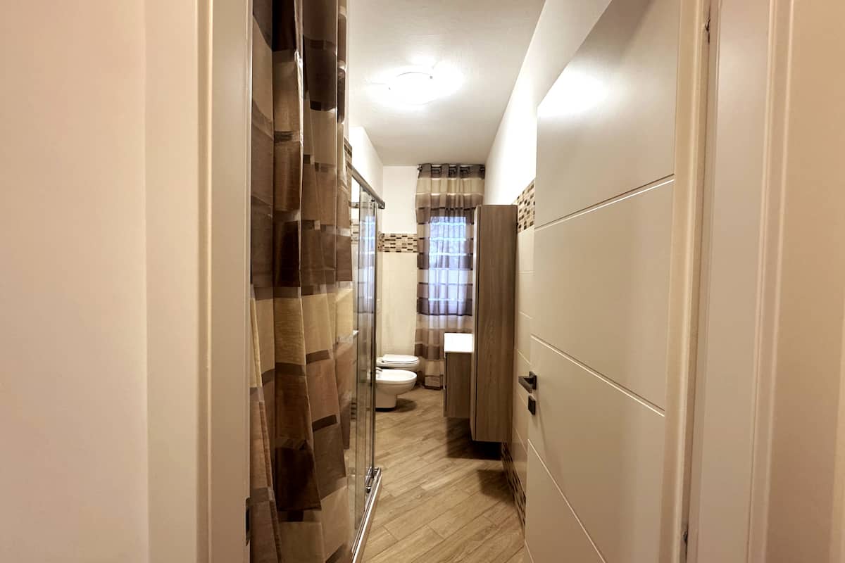 Bagno e lavanderia di Dimora Cabiria
