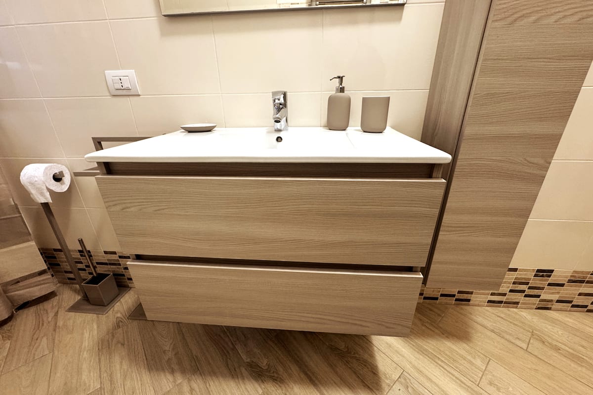 Bagno e lavanderia di Dimora Cabiria
