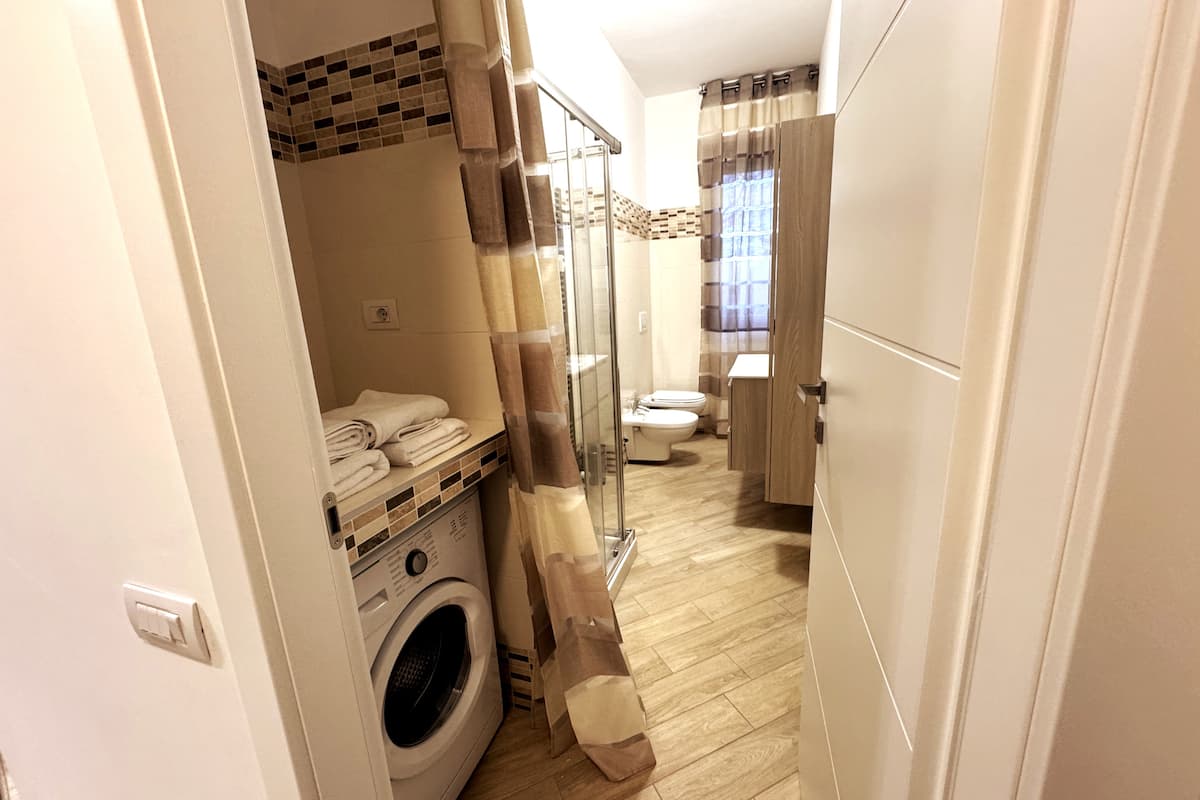 Bagno e lavanderia di Dimora Cabiria
